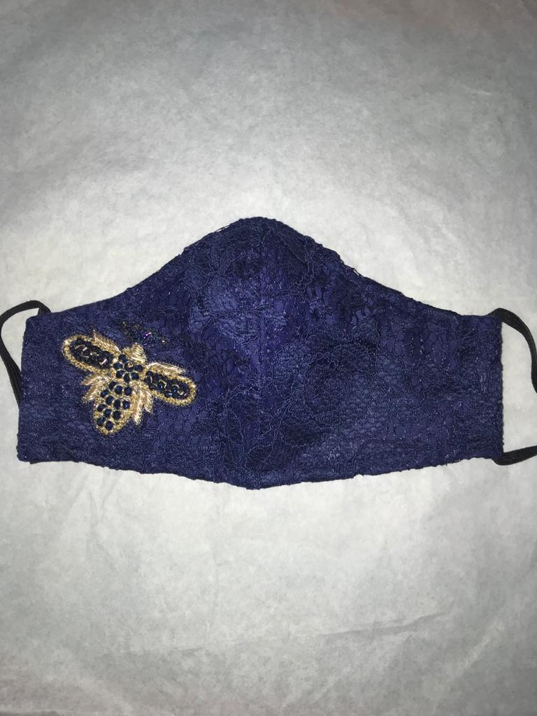 Lace mask with beaded motive